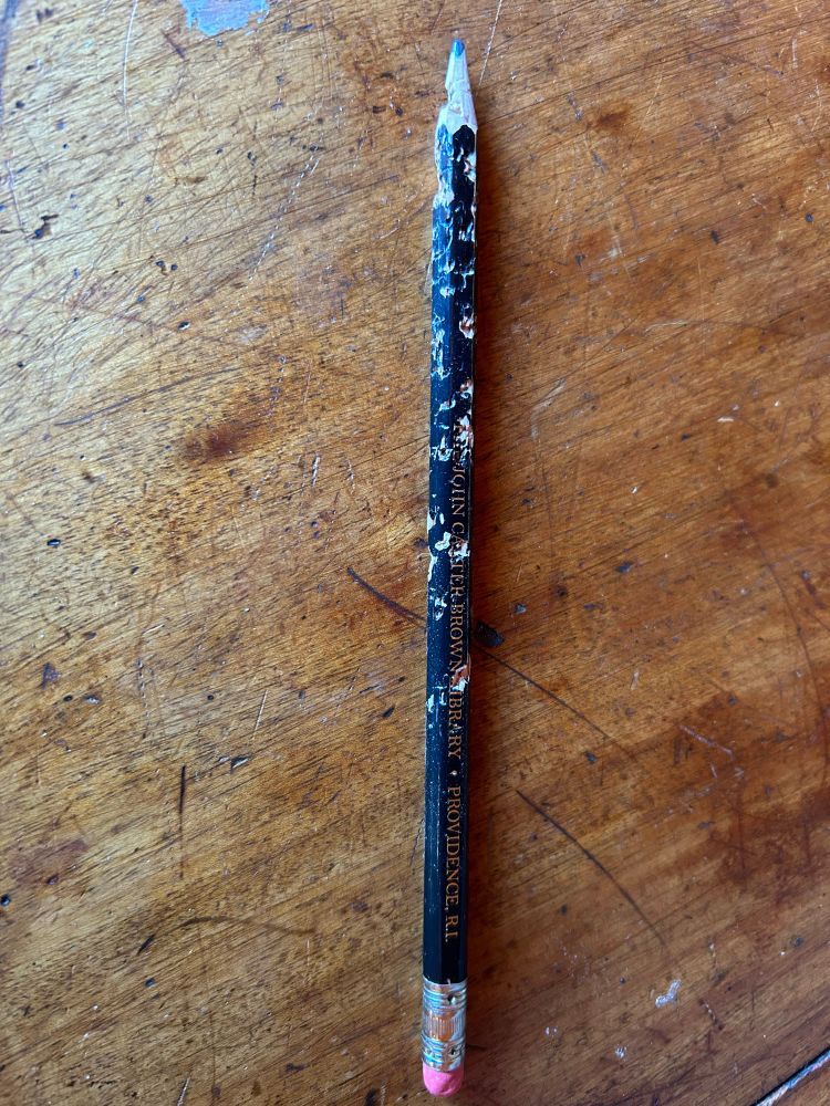 A pencil heavily chewed by a kitten 