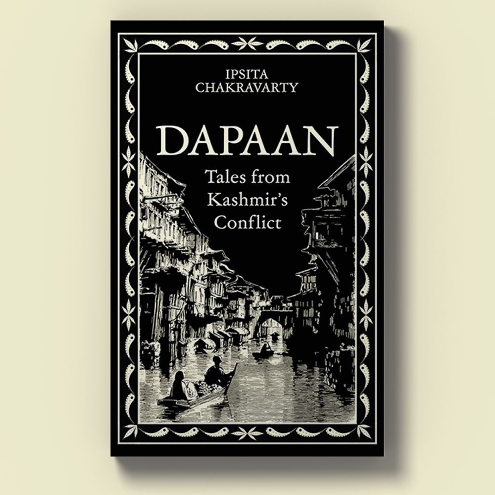 Cream background with a black cover showing a neighbourhood in Kashmir with a river flowing in the middle (in black and white).