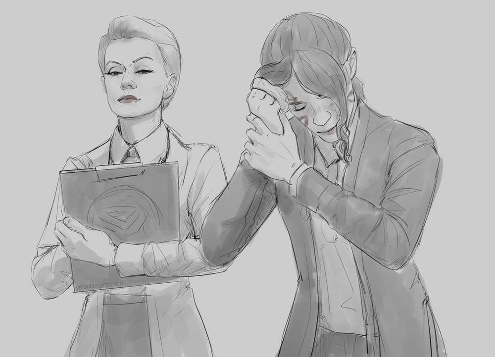 Jesse Faden removing lipstick marks from her face left by Emily, who's next to her and looking smug.