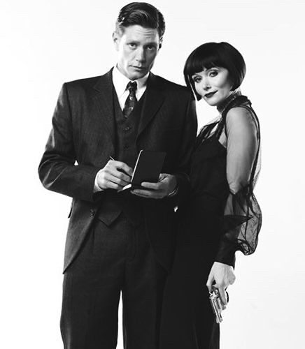 Black and white promo photo of Jack and Phryne looking beautiful
