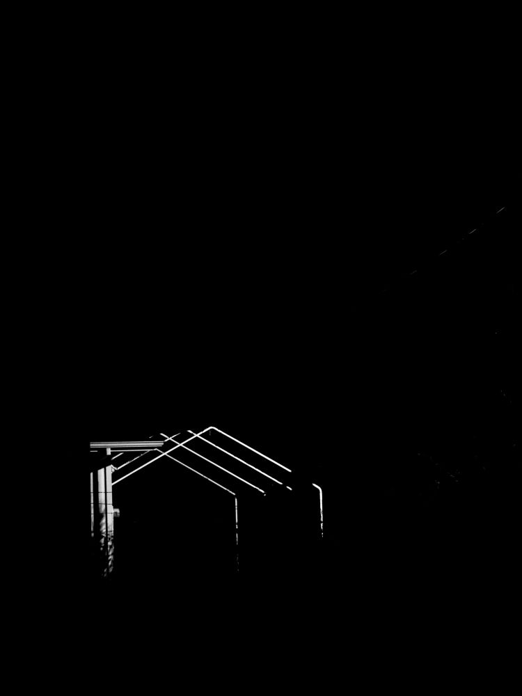 Black and white photo of a tent canopy frame brightly lit in a complete void.

Personal note: This is the biggest offender of me using contrast to add intrigue to an image but I dont care. Plus the original was already super contrast-y, I just nudged it the rest of the way there.