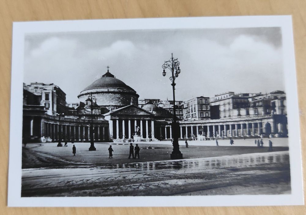 column rows and a roman style church in the middle of the half round