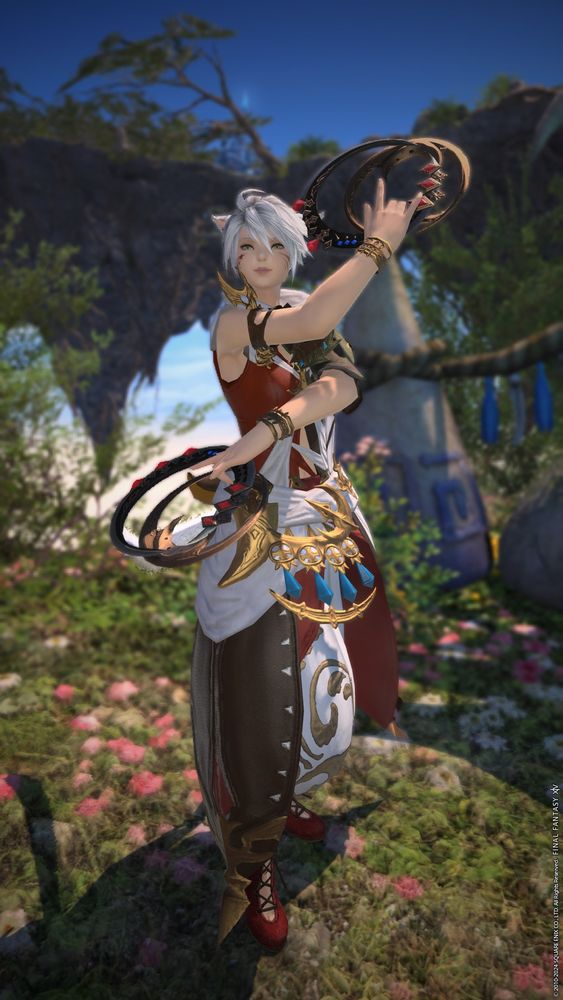 a final fantasy 14 screenshot showing a white-haired miqo'te dancer in a red and white outfit with golden accents. she's striking a pose with her chakrams.