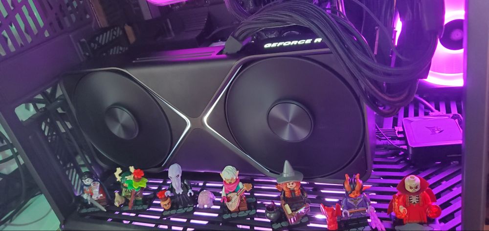 LEGO Dungeons & Dragons characters arrayed in front of an RTX 5090 Founders Edition graphics card.