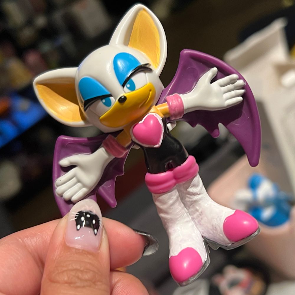 a Burger King toy of rouge the bat from sonic the hedgehog, painted to be somewhat accurate