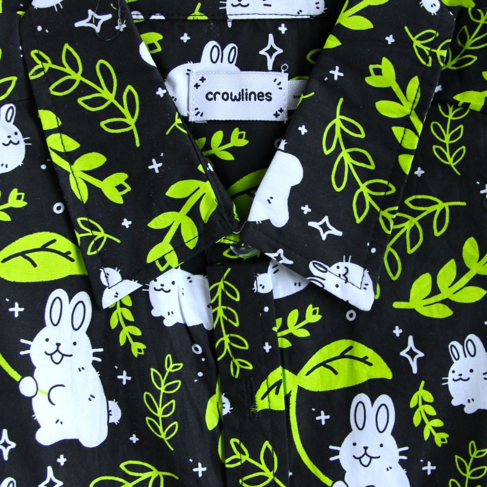 Black button up shirt patterned with bunnies and leaves