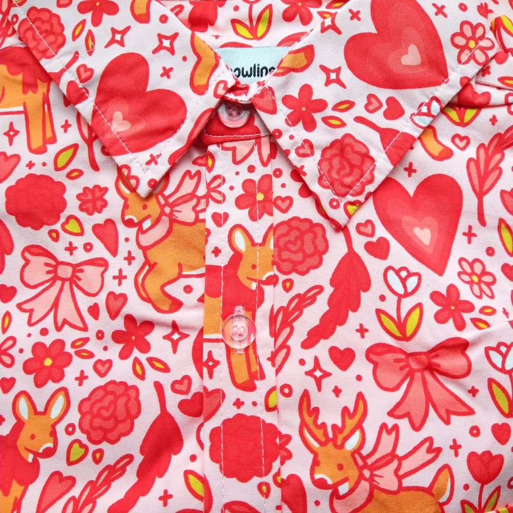 pink button up shirt patterned with deer and flowers