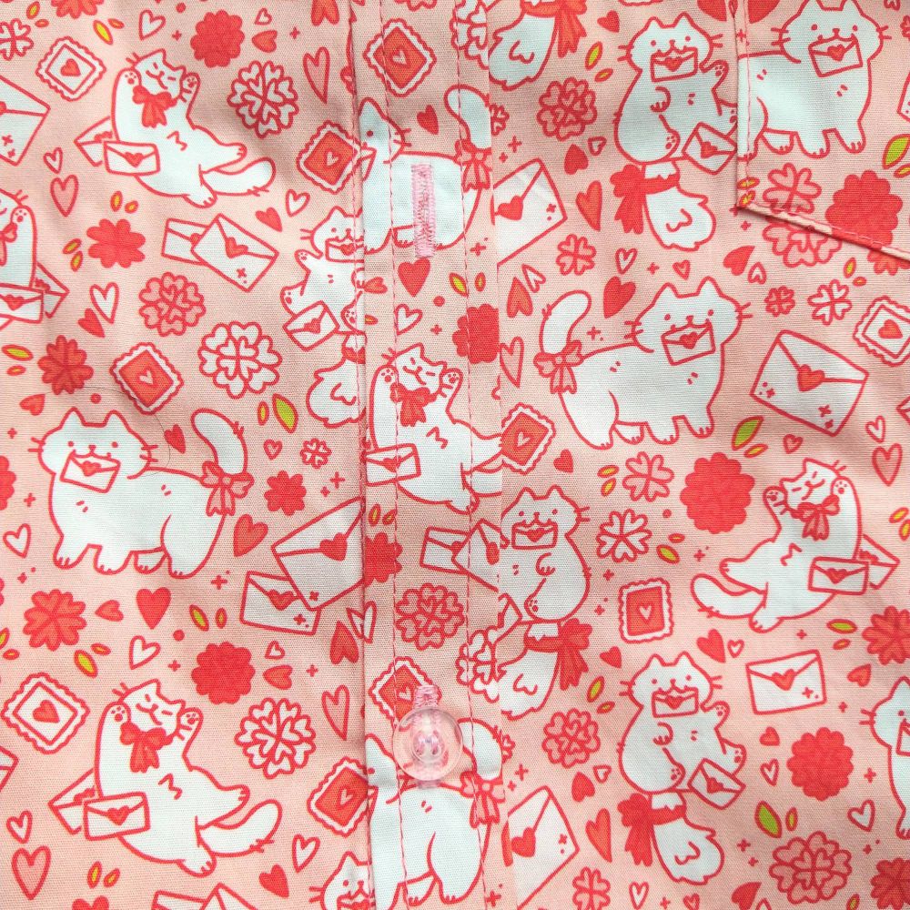 pink button up shirt patterned with cats and love letters