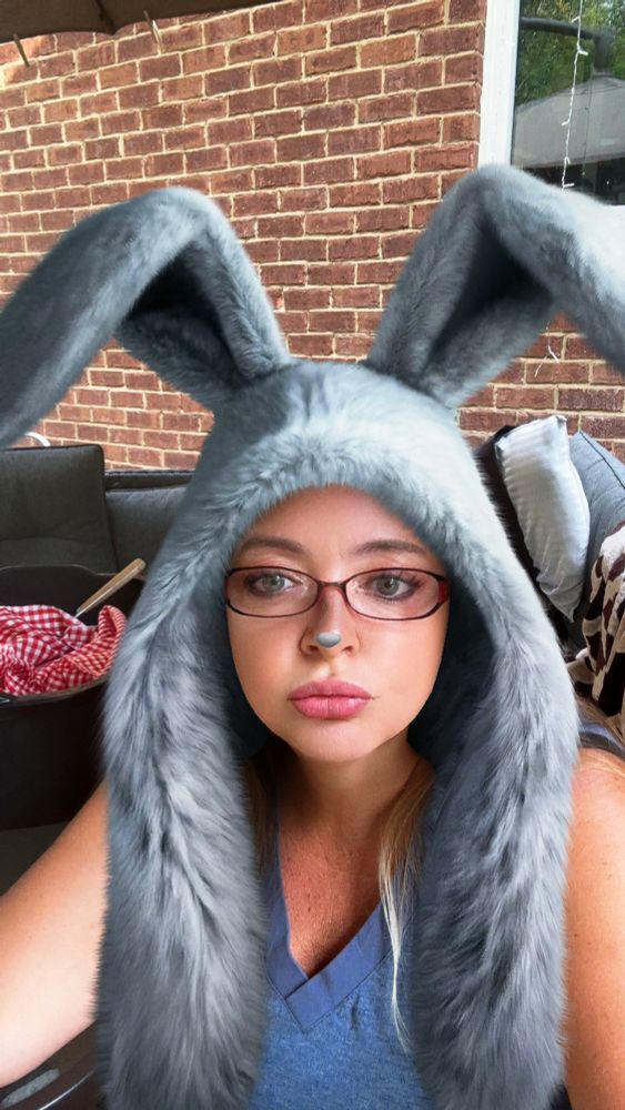 Me in a bunny hat with ears, it’s grey and fluffy.  