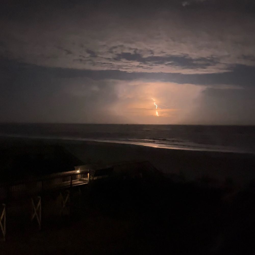 A picture of lightning over the midnight ocean.