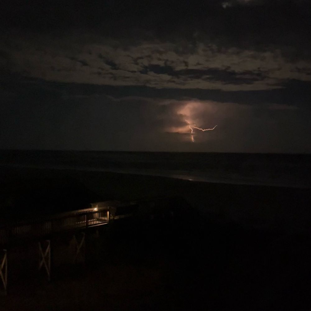 A picture of lightning over the midnight ocean.