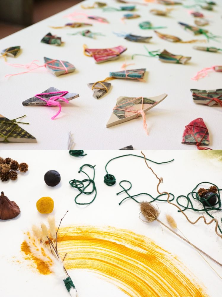 1. Textile square says solidarity forever. Bottom image is a mirror that says Do not let the art work touch you. 2. Shards of painted ceramic tied with ribbons on top. Bottom show materials from nature including a smear of yellow powder, acorns and string. 3. Private Bye, a fake newspaper, shows impeachment specials. The bottom image shows magnets that say This decision is by the people for the people.