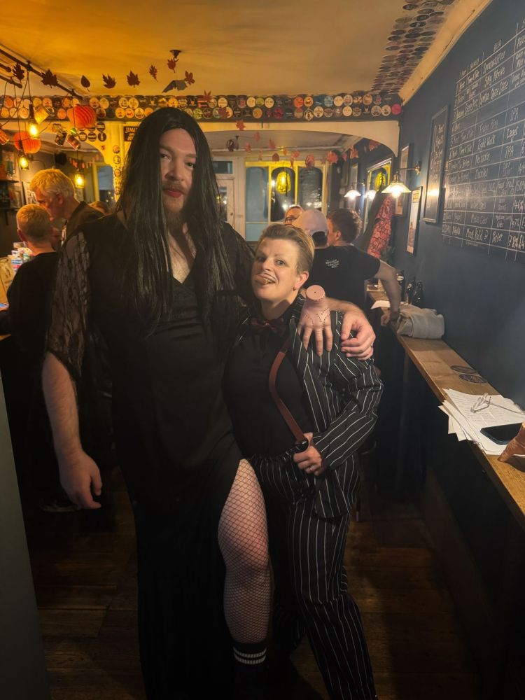 Me and my (6ft 6" cis male) friend as morticia and gomez