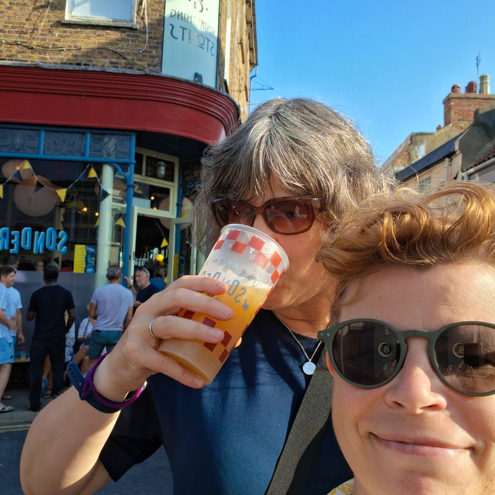My stupid head with my wife a taller woman stood behind me drinking a beer