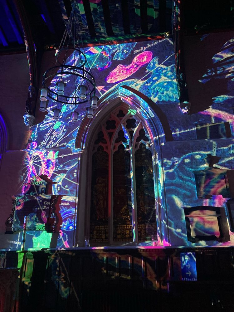 Colourful light projections inside Leicester Cathedral.