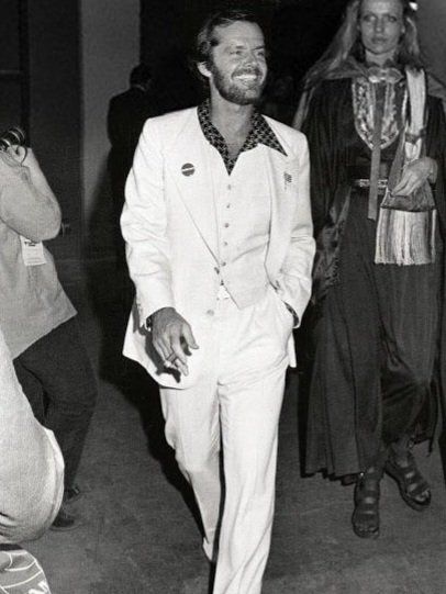 70s era Jack Nicholson in a white suit looking fabulous. 