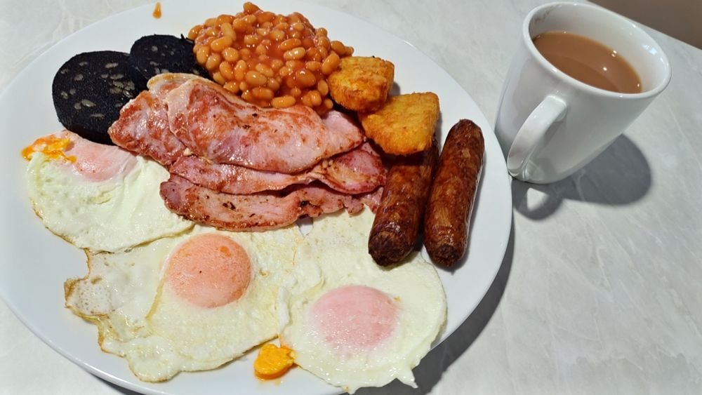 A full English breakfast with a mug of tea