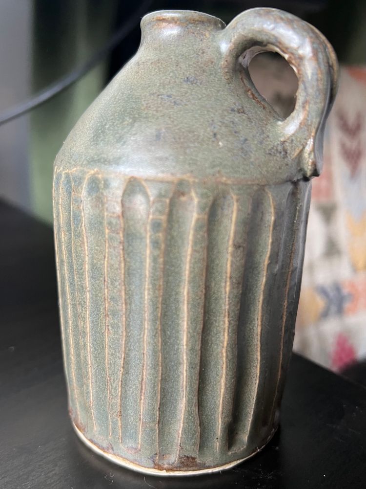 Hand sized faceted jug