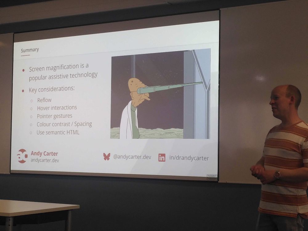 Andy in front of a slide summarising his talk, with a Futurama gif.