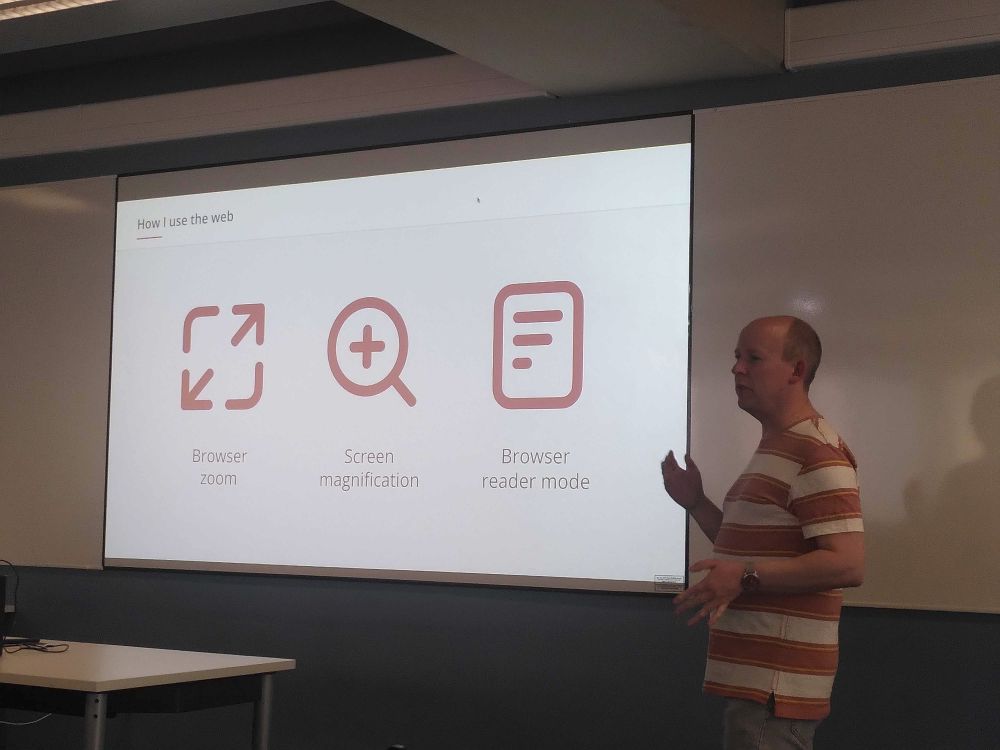 Andy in front of a slide saying 'browser zoom, screen magnification and browser reader mode'