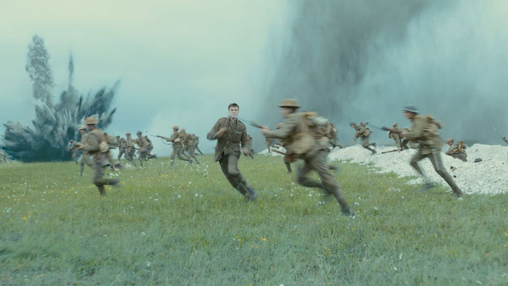 A WWI soldier running perpendicular to an attack