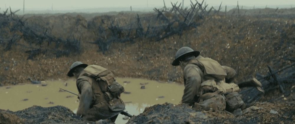 Two WWI soldiers navigating a crater in No Man's Land