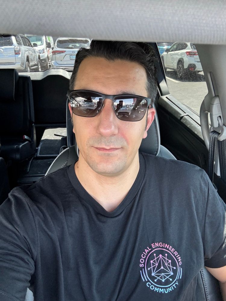 Joe sitting in his mini van with black seats