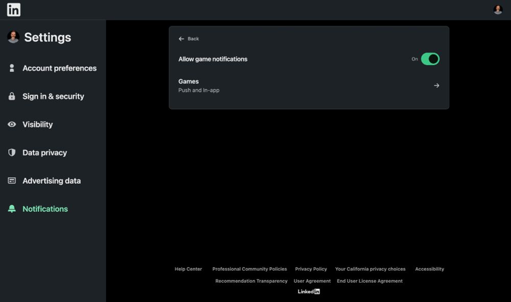 A LinkedIn settings page interface showing a dark mode view. The left sidebar contains menu items including Settings, Account preferences, and Notifications. The main panel displays game notification settings with a toggle switch set to 'On' and a Games section labeled 'Push and In-app'. 