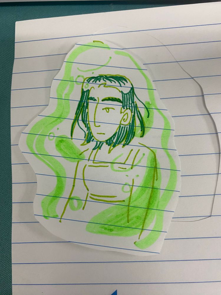 drawing of a girl done in assorted green markers on lined paper 