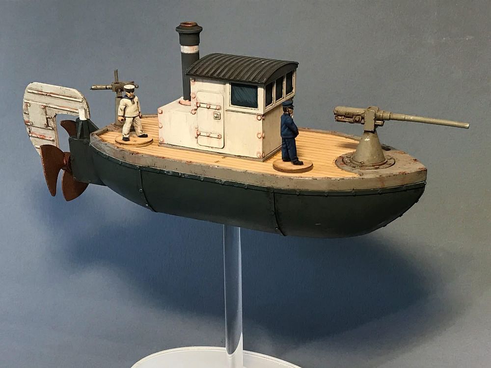 Side view of the new picket neff. Lower hull is painted dark grey, deck section is painted medium grey and has veneer decking. Wheel house is painted white with a dark grey roof and funnel. 