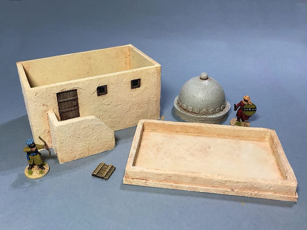 The single story building with the roof and dome off to show that there’s interior access. The two crusader figures are looking on in wonderment as this has never happened before. 