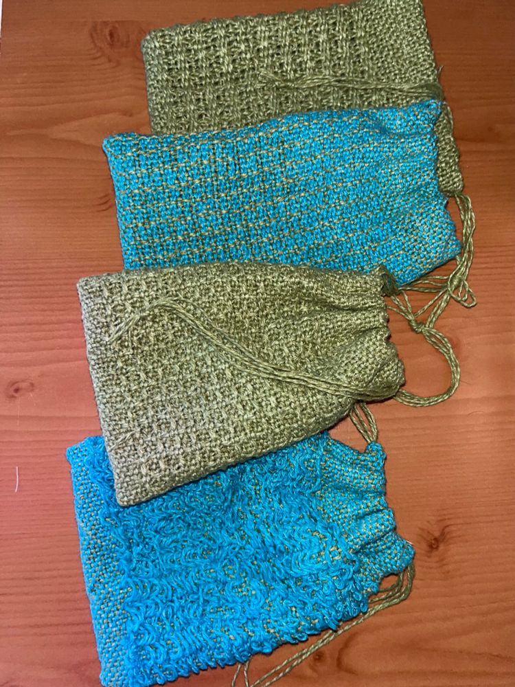 4 blues and green woven bags with drawstrings for bits of soap