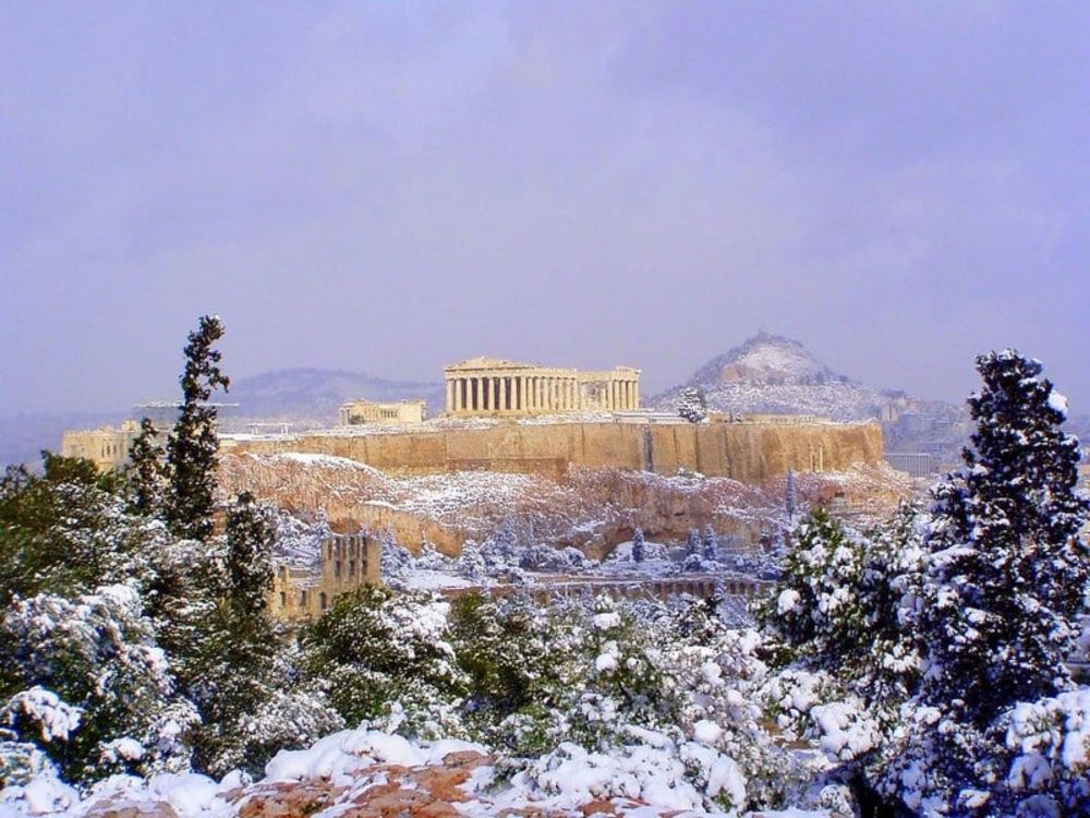 Greece braced for adverse weather, some of Athens' northernmost suburbs covered in snow since the early hours of Saturday.