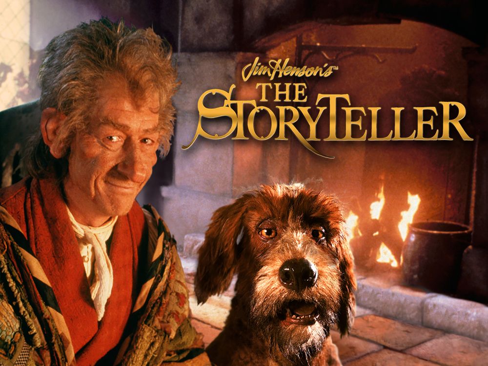 Jim Henson's The Storyteller: John Hurt as the Storyteller, with his dog (voiced by Brian Henson), sat by a roaring fire in a stone fireplace. 