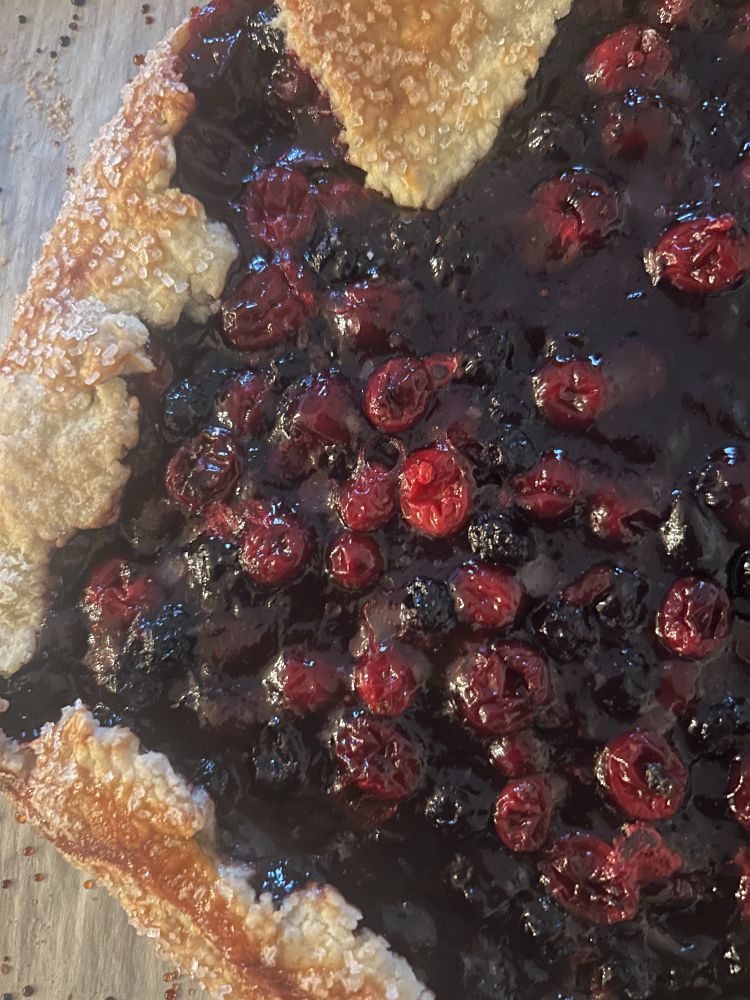 rough edged pie crust filled with berries