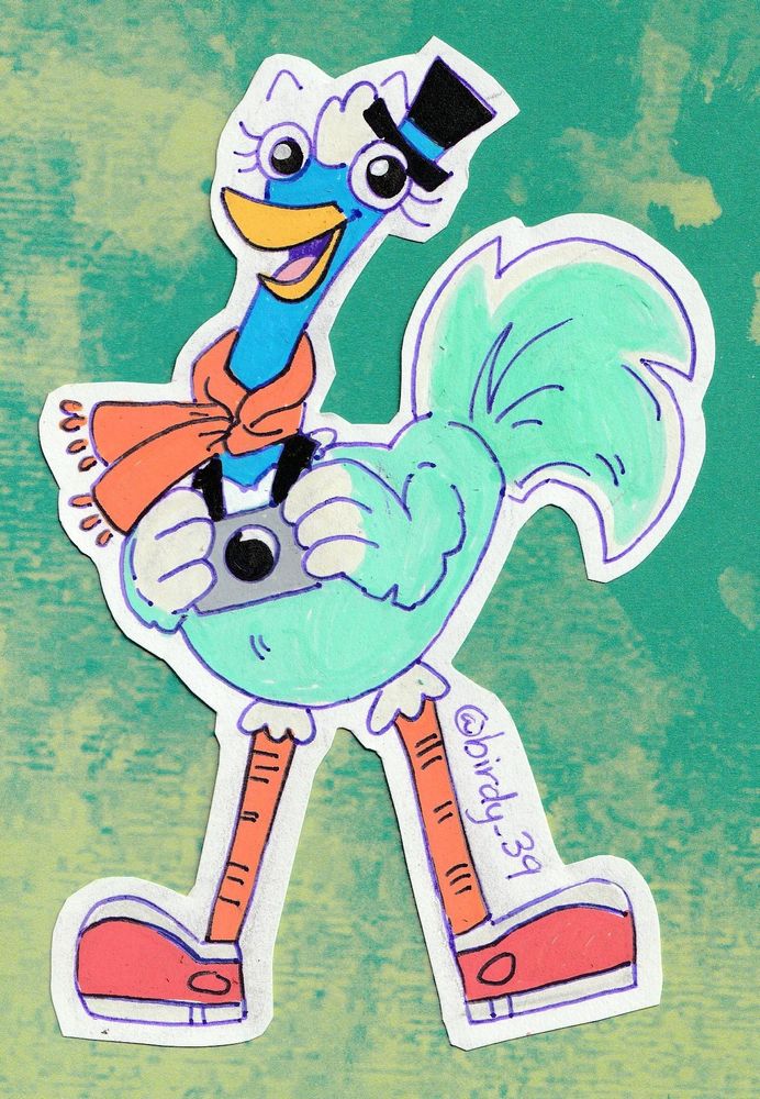 A simple illustration of a blue ostrich character. She wears a top hat, an orange scarf, and red running shoes. She smiles as she holds a camera.