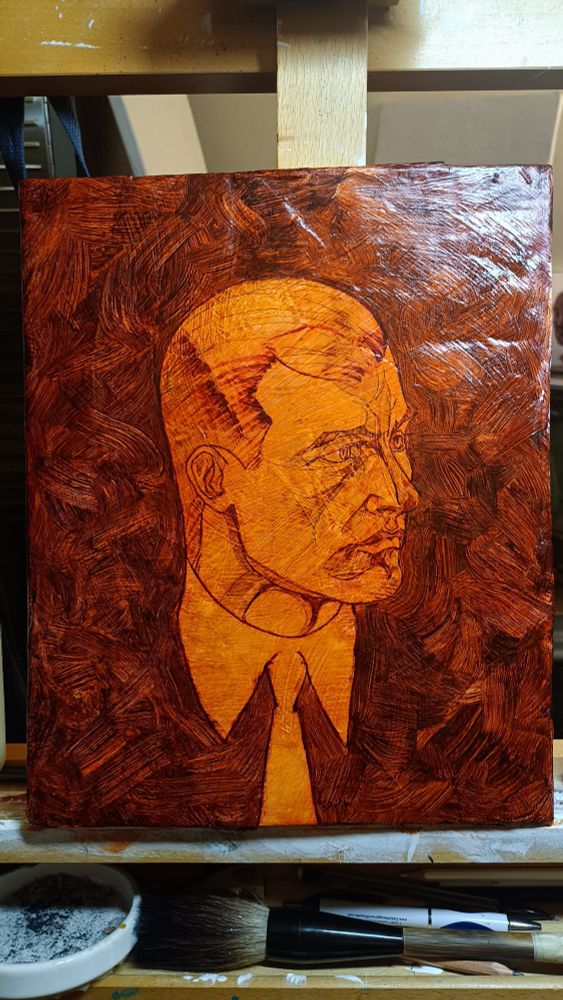 an underpainting of a man's face glazed over in a dark amber semitransparent layer. 