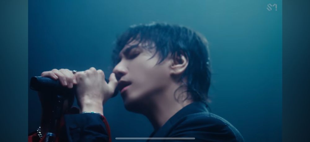 Yesung singing in the rain (taken from the music video for the song “It’s Complicated”)