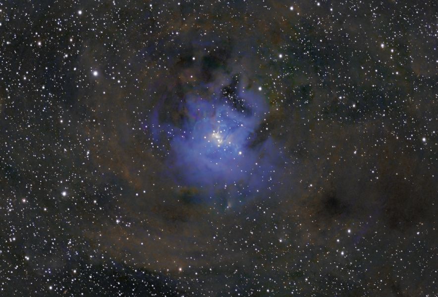 Gas clouds in the milky way are glowing in an intense blue which contrast with the brownish clours of surrounding molecular clouds.