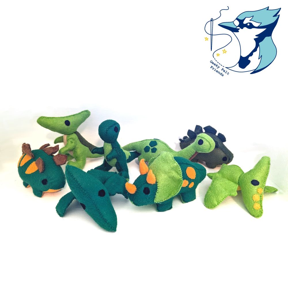 A photo of several baby dinosaurs of different species, all in shades of green