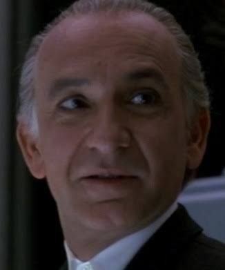 Ben Kingsley in Sneakers (1992), the movie not the shoe. he says "Marty" a bunch in this movie, and you see, in Quiz Show, the whole gig is up because Turturro's character had to throw the game [SPOILIES] on a question about the movie Marty (1955), which stars Ernest Borgnine who is also cool as shit, like Robert Redford. 