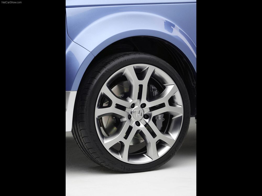 Wheels on the Honda Element Concept as unveiled at SEMA in 2002, features a unique body treatment and tri-color silver-blue-black paint job.