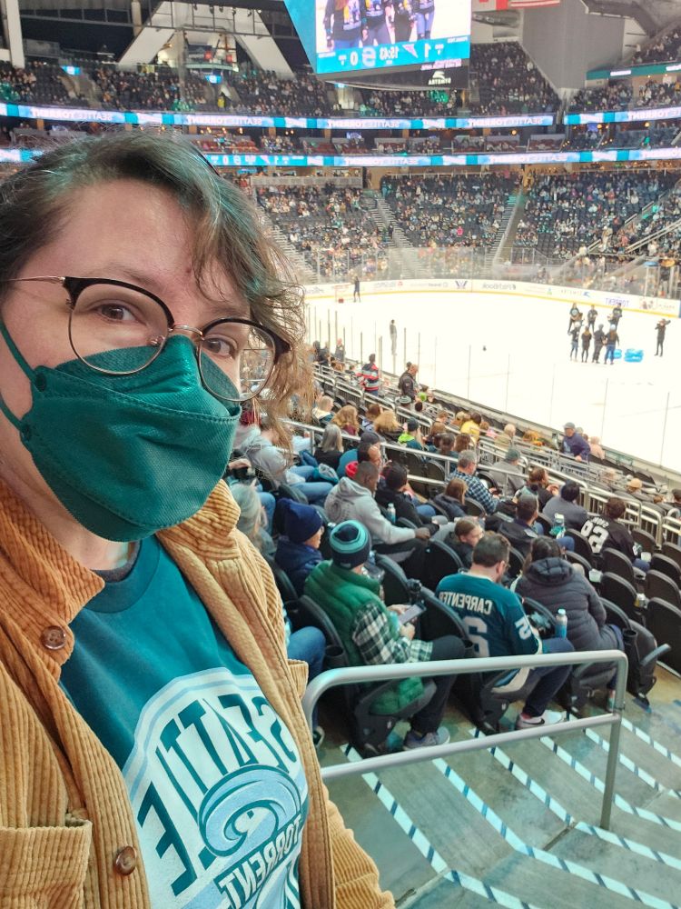 A picture of me wearing my new torrent shirt and intermission ice shenigans behind me