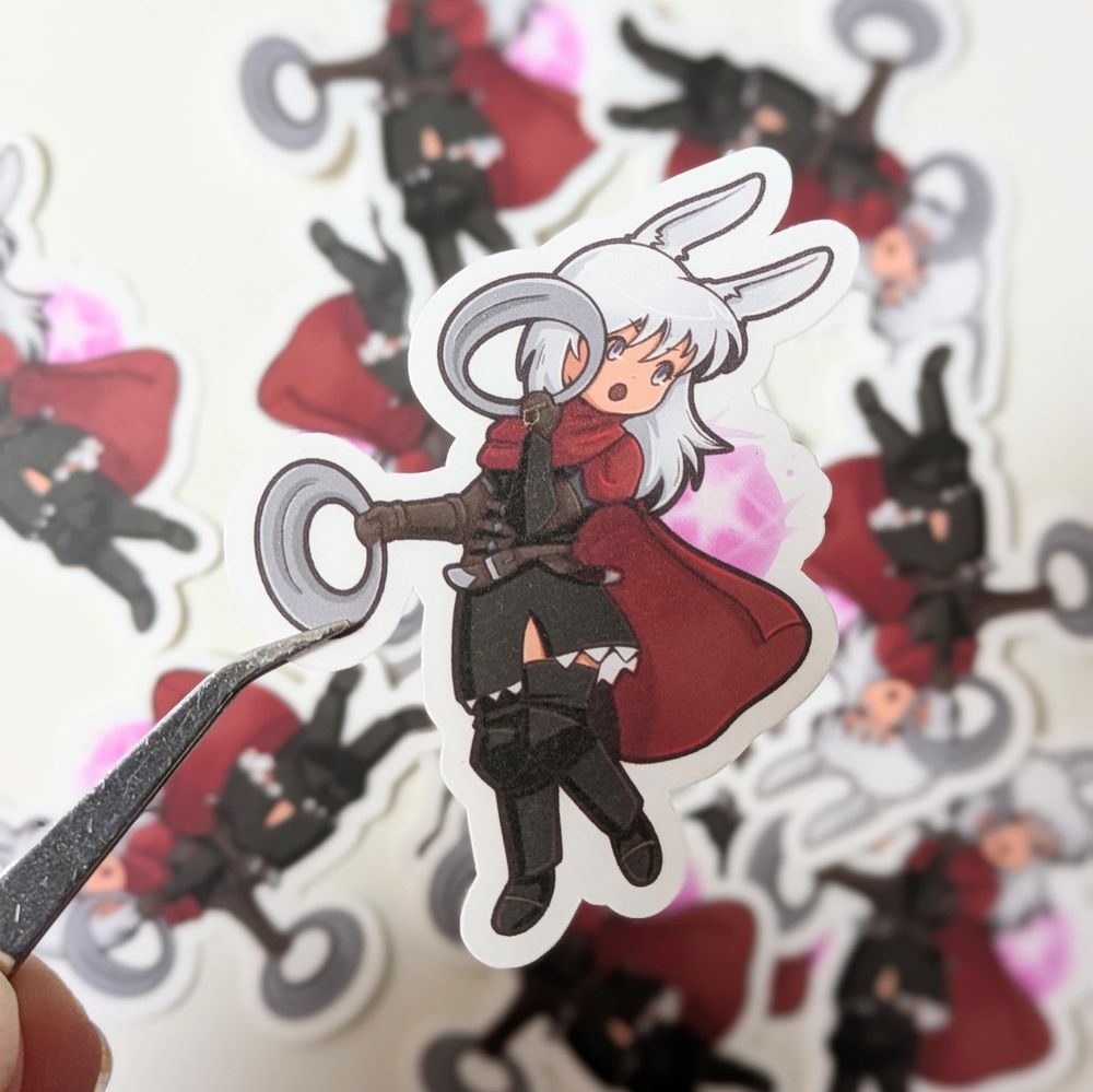 Sticker of Lyna from ffxiv. Lyna is a Viera, a human woman with bunny ears and white long hair. She wears a dark brown fantasy uniform and a red cloak. She is wielding two chacrams.