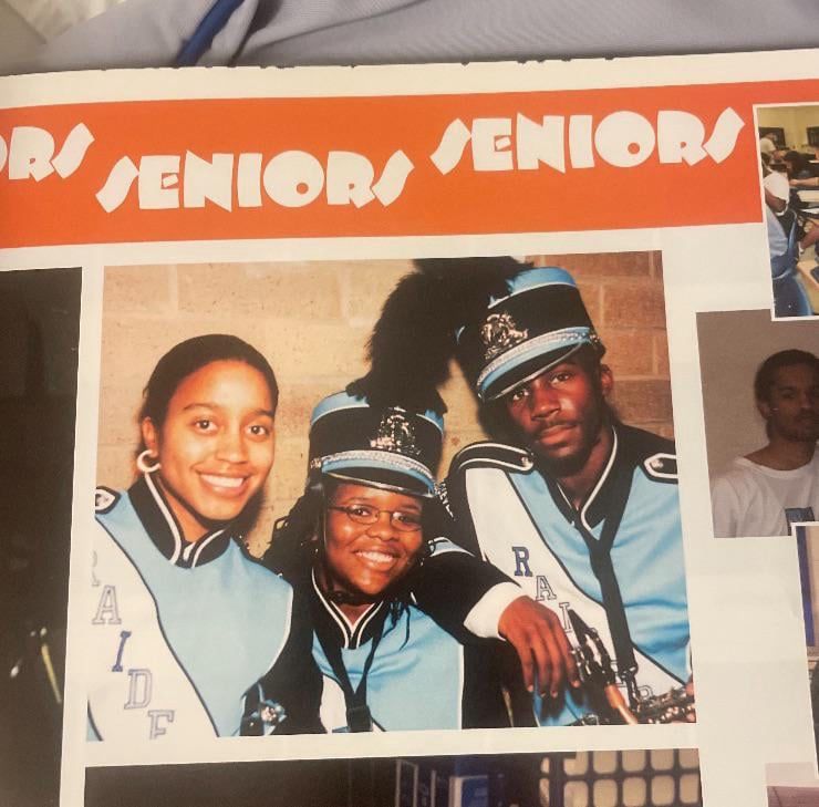 tramell tillman (right, center picture) dressed in raiders marching band uniform
