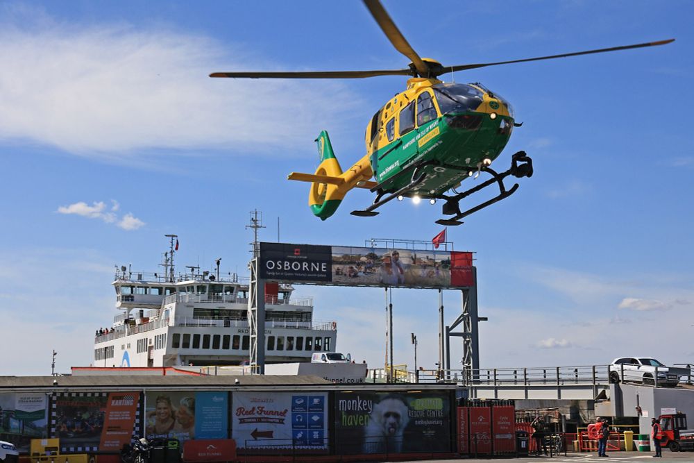Yellow and green helicopter at the Red Funnel ferry terminal in Southampton. 