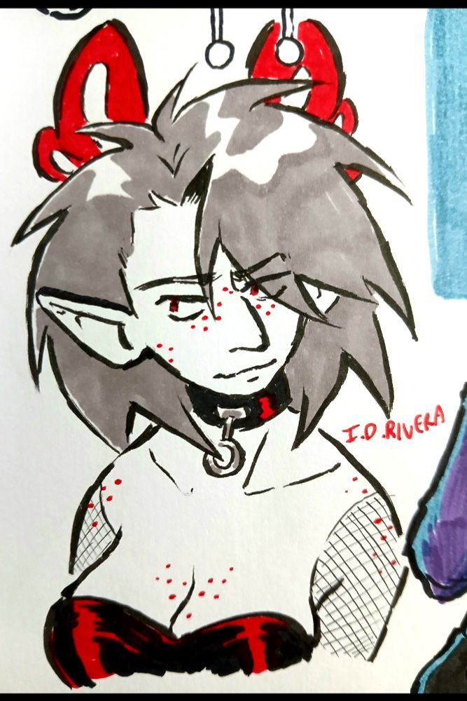 Axel (he/him) wearing a collar and a top that shows off his bosom.