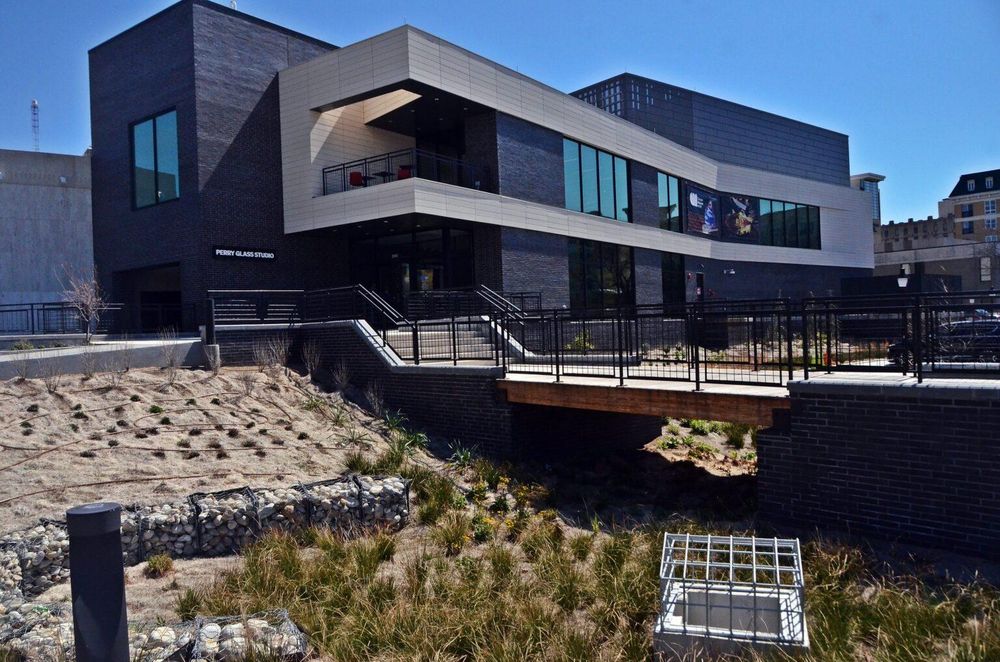 Museum space over floodable ground. The Chrysler Museum of Art in Norfolk, Virginia, and its Perry Glass Studio expansion, seen here, sit at the culmination of The Hague, an inlet of the Elizabeth River. (Photo by Jim Morrison for the Virginia Mercury)