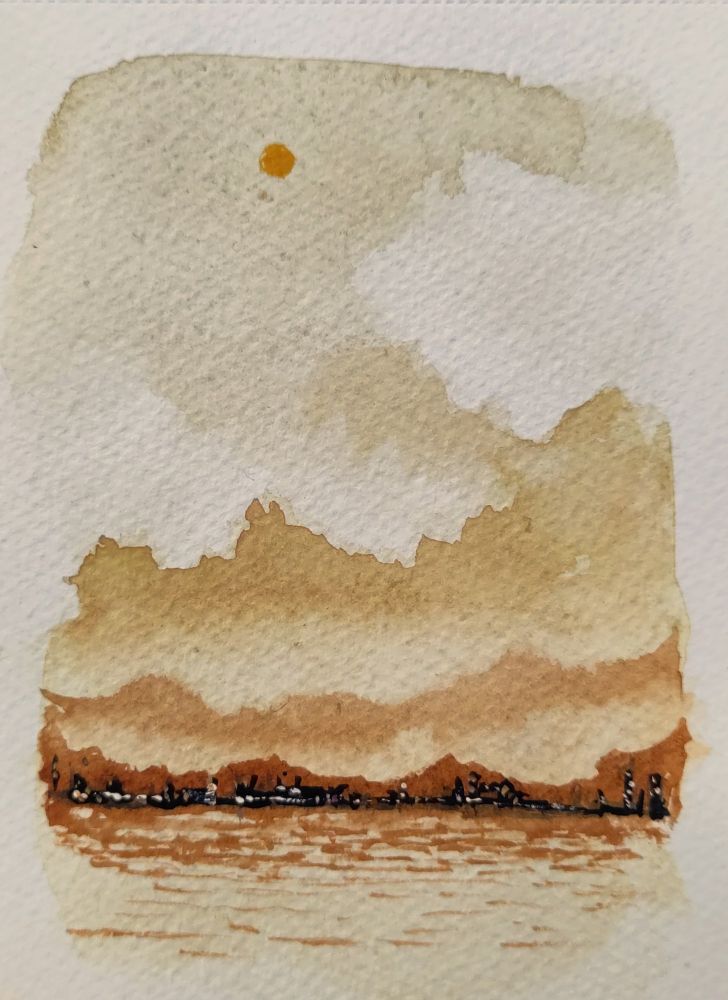 A small watercolour painting of a cloudy, orange sky. There is a distant, silhouetted city on the banks of a lake with lights glinting.