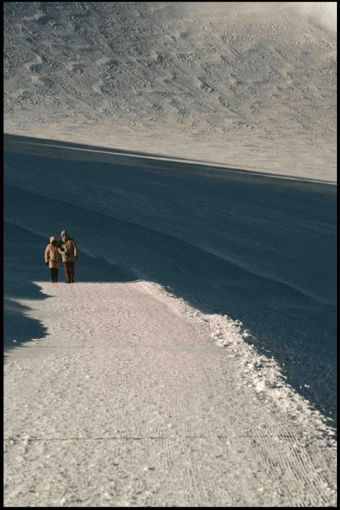 a old couple surrounded by snow